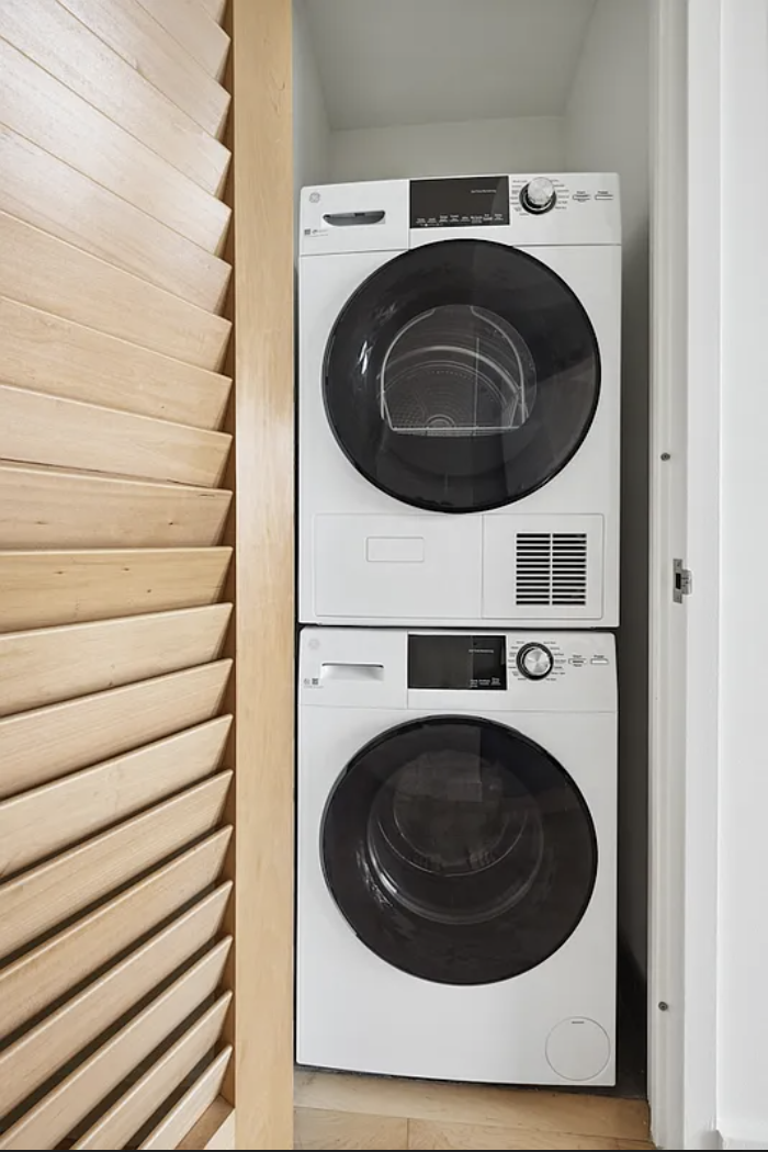 Spruce Street, Unit 12A Manhattan, NY 10038 - Photo 5 of 18 a utility room with dryer and washer