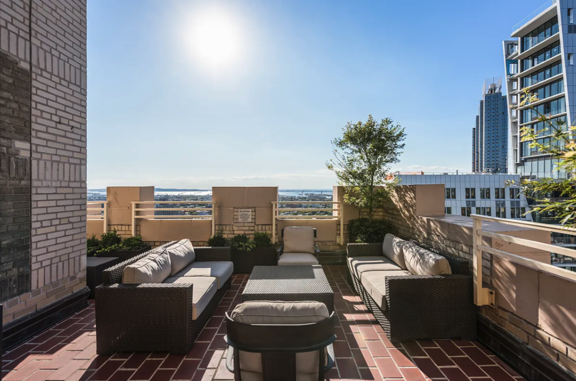 1 Hanson Place, Unit 15C Brooklyn, NY 11243 - Photo 6 of 8 a balcony with furniture and city view