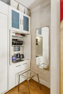 a kitchen with stainless steel appliances kitchen island granite countertop a refrigerator and a stove top oven