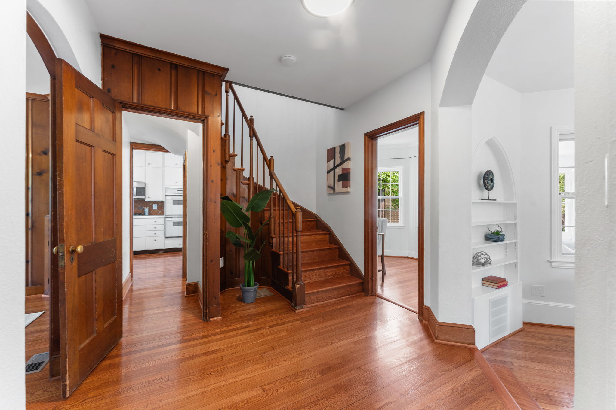 1325 Locust Road Northwest Washington, DC 20012 - Photo 6 of 56 a view of hallway with wooden floor and stairs