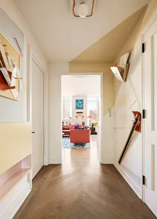 a view of a livingroom with furniture and a ceiling fan