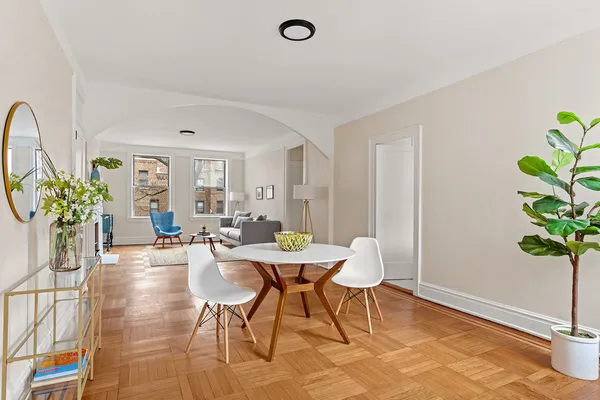 a view of a livingroom with furniture and a potted plant