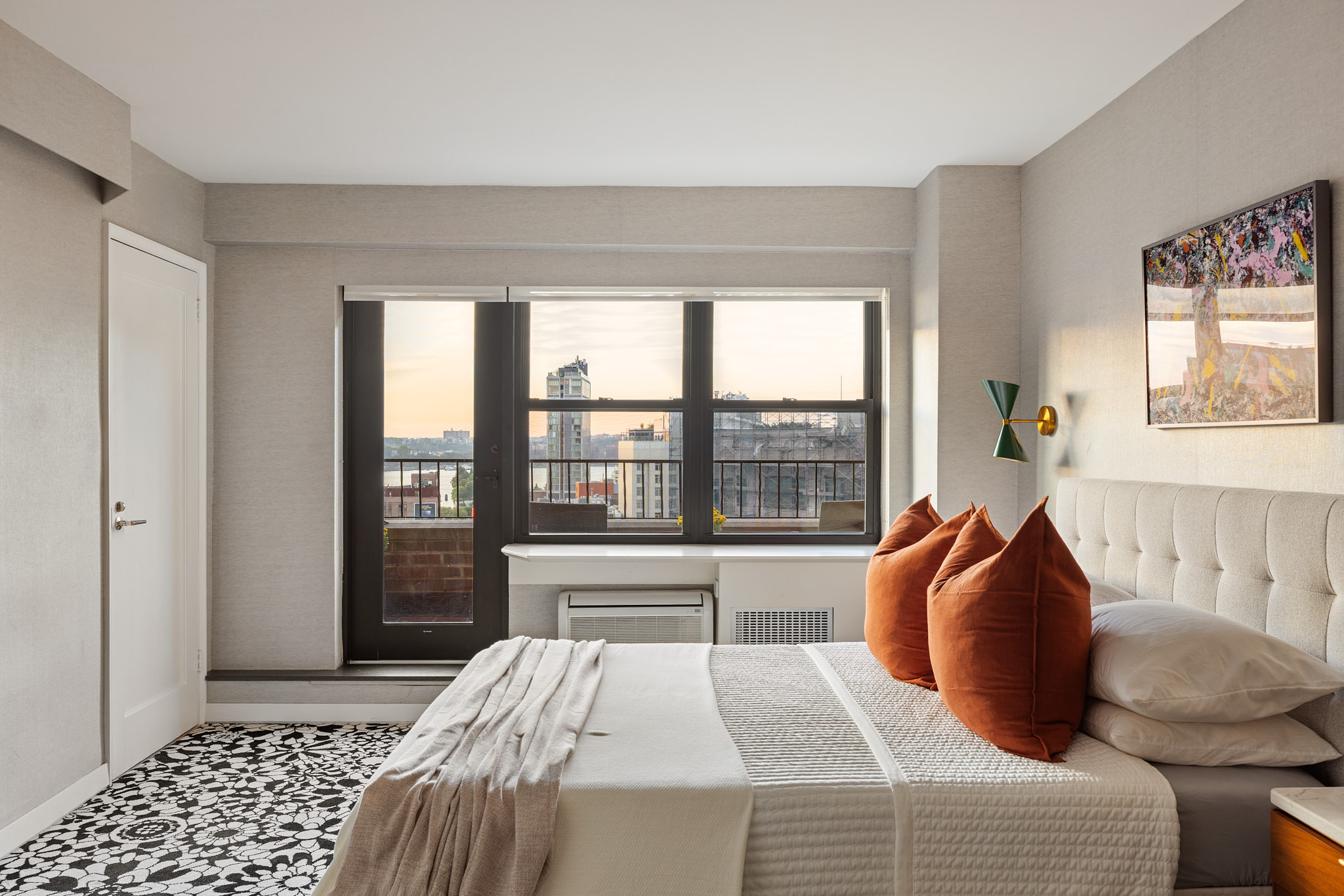 31 Jane Street, Unit 16A Manhattan, NY 10014 - Photo 7 of 17 a bedroom with a bed and a large window