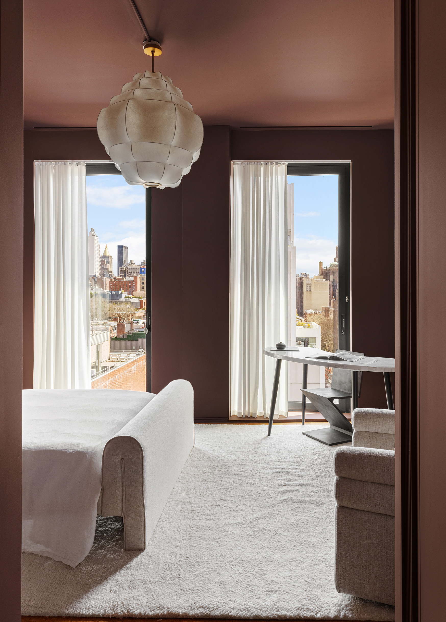 505 West 19th Street, Unit PH1 Manhattan, NY 10011 - Photo 24 of 26 a bedroom with furniture and a large window