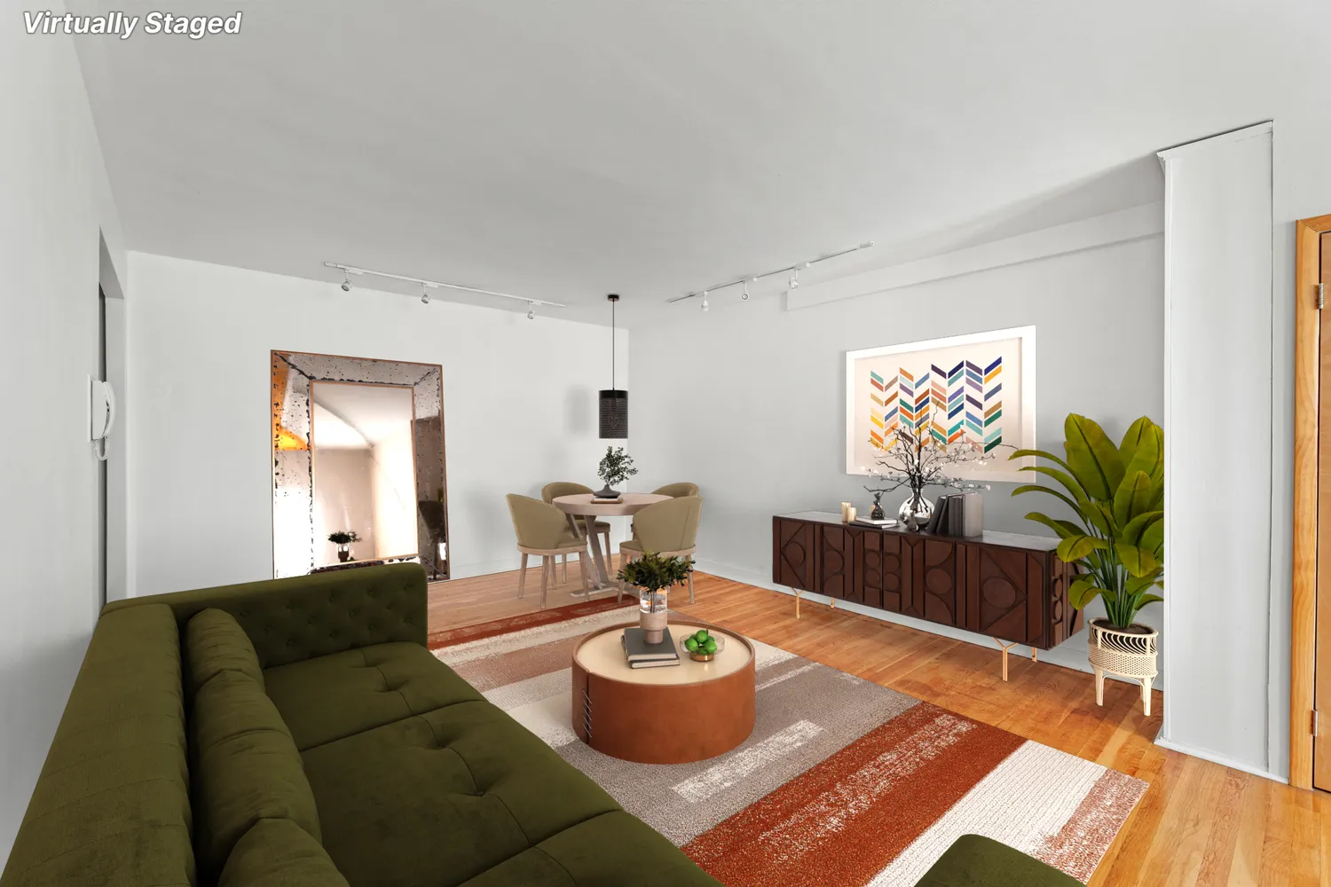 a living room with furniture and a wooden floor