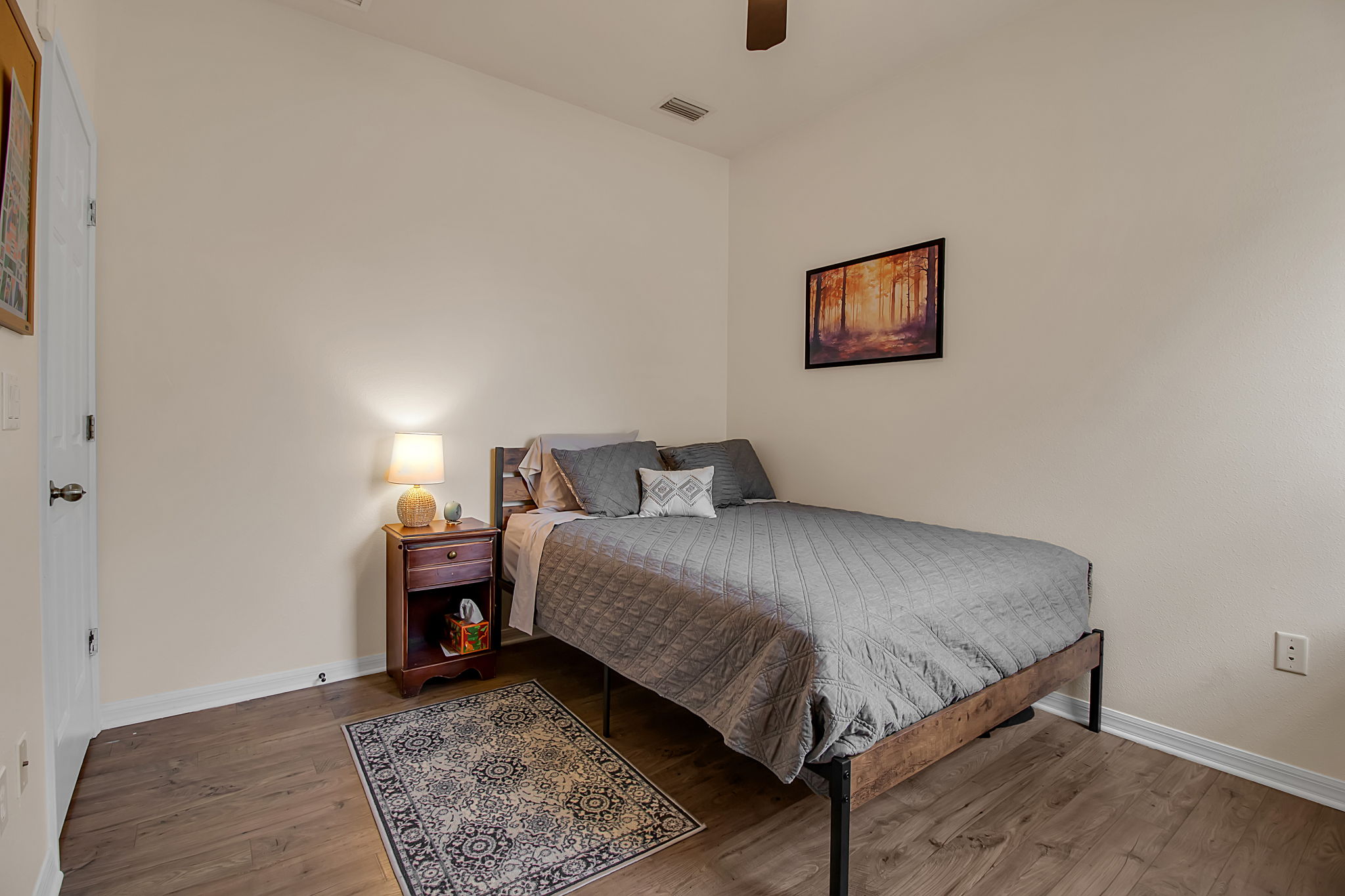 6106 34th Court East Bradenton, FL 34203 - Photo 48 of 69 a bed room with a bed and a chair