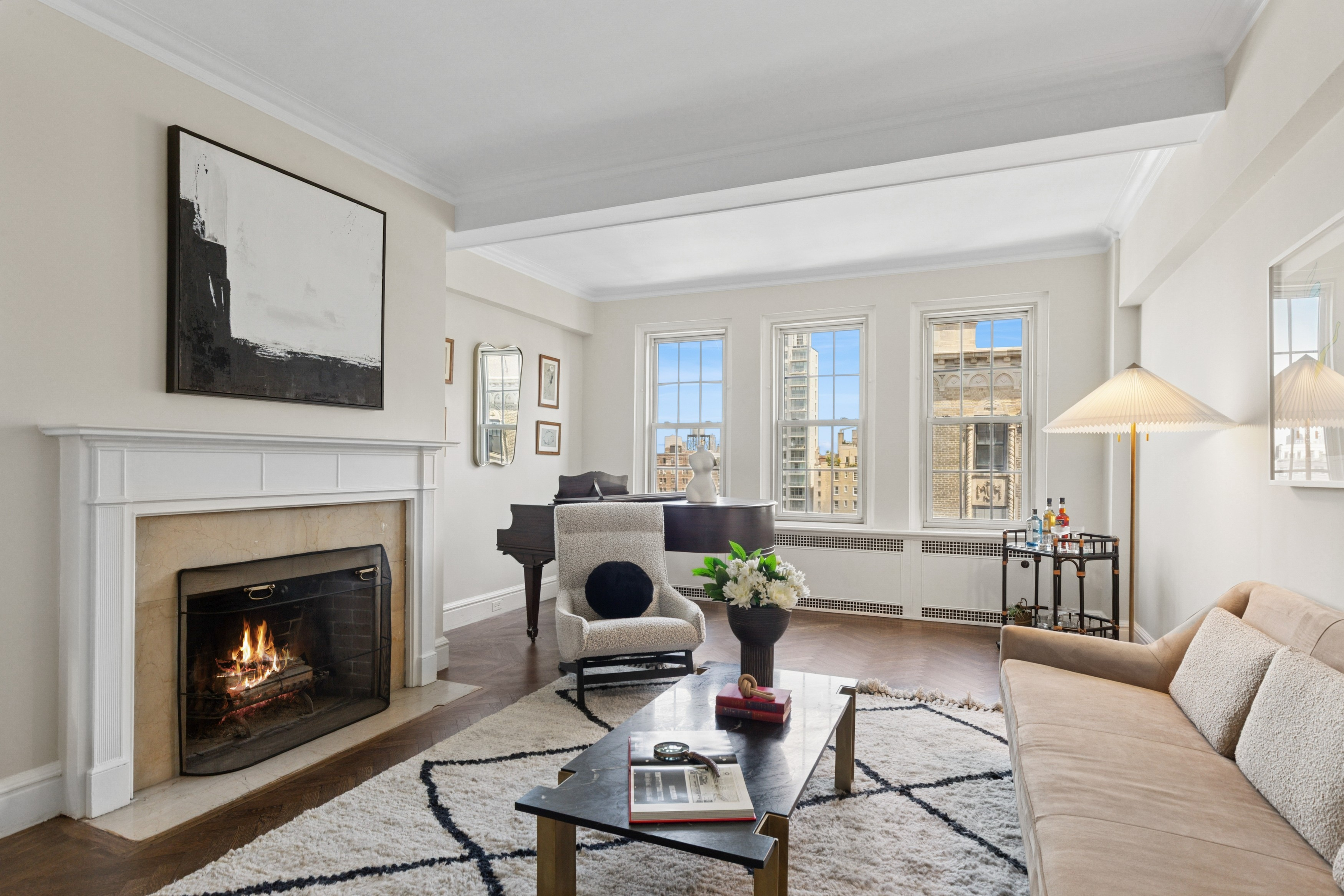 336 Central Park West, Unit 16F Manhattan, NY 10025 - Photo 2 of 18 a living room with furniture and a fireplace