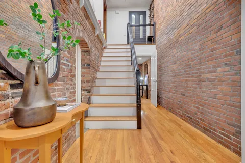 a kitchen with stainless steel appliances granite countertop a stove a sink dishwasher and a refrigerator