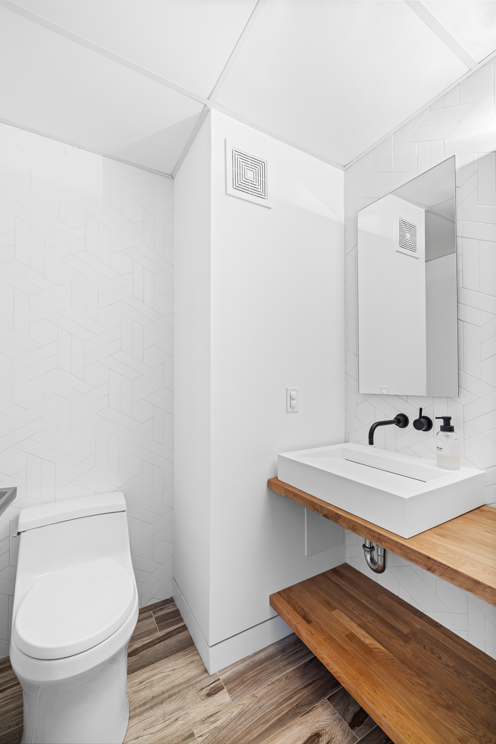 240 West 98th Street, Unit 8D Manhattan, NY 10025 - Photo 10 of 12 a bathroom with a sink toilet and mirror