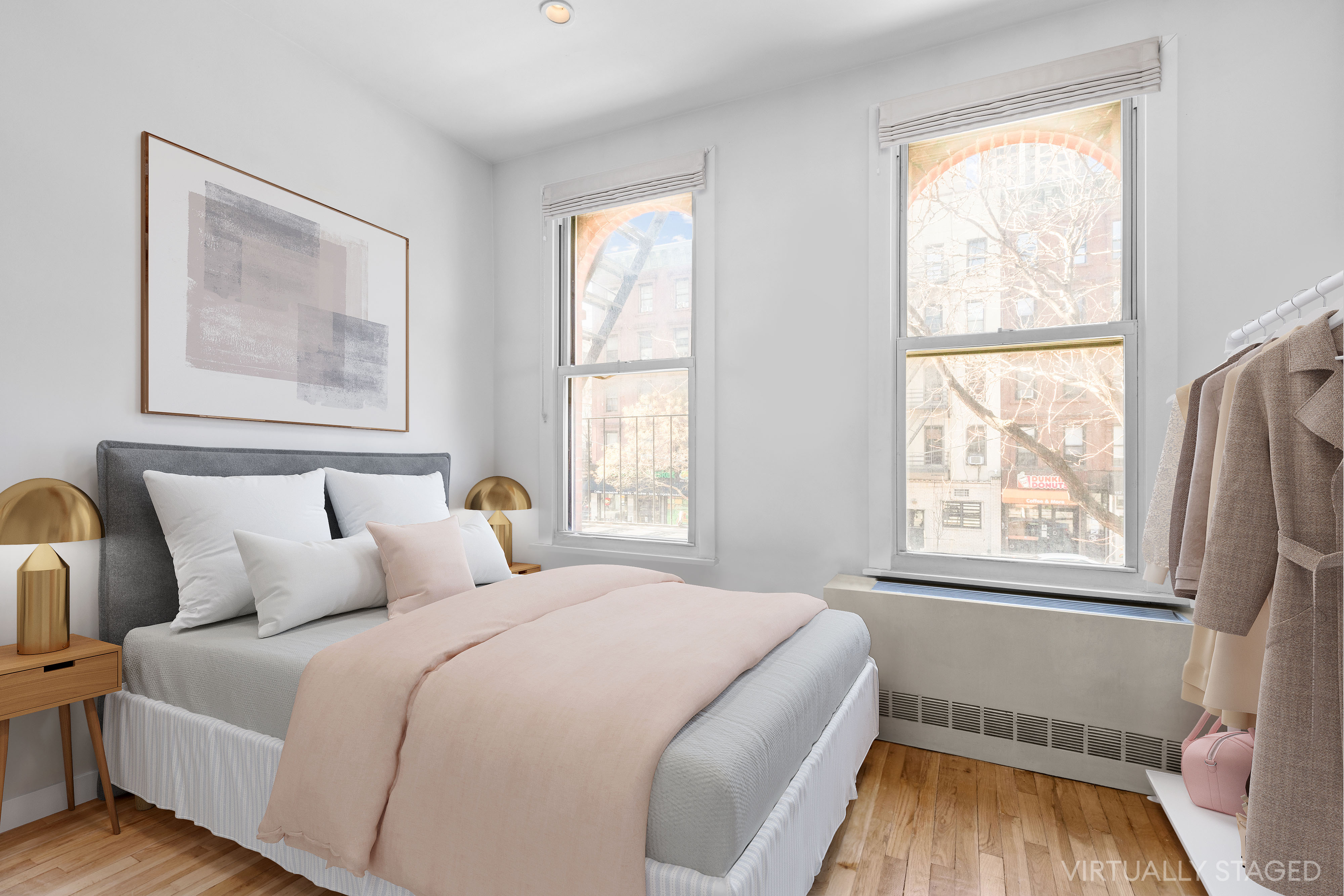 1582 York Avenue, Unit 2A Manhattan, NY 10028 - Photo 2 of 5 a bedroom with a bed and a window