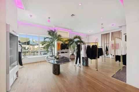 a living room with lots of furniture and gym equipment