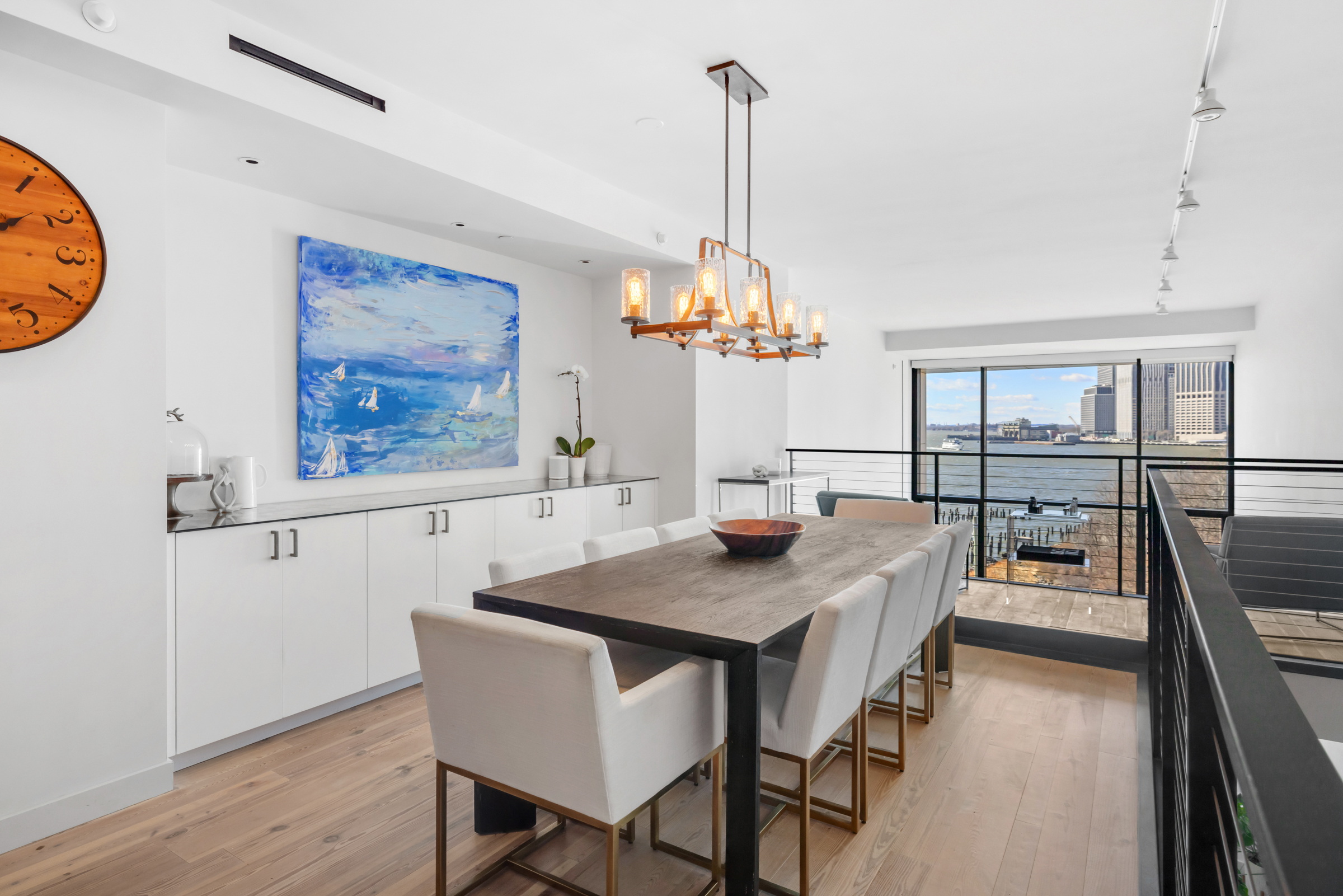 90 Furman Street, Unit N609 Brooklyn, NY 11201 - Photo 3 of 28 a view of a dining room with furniture window and wooden floor