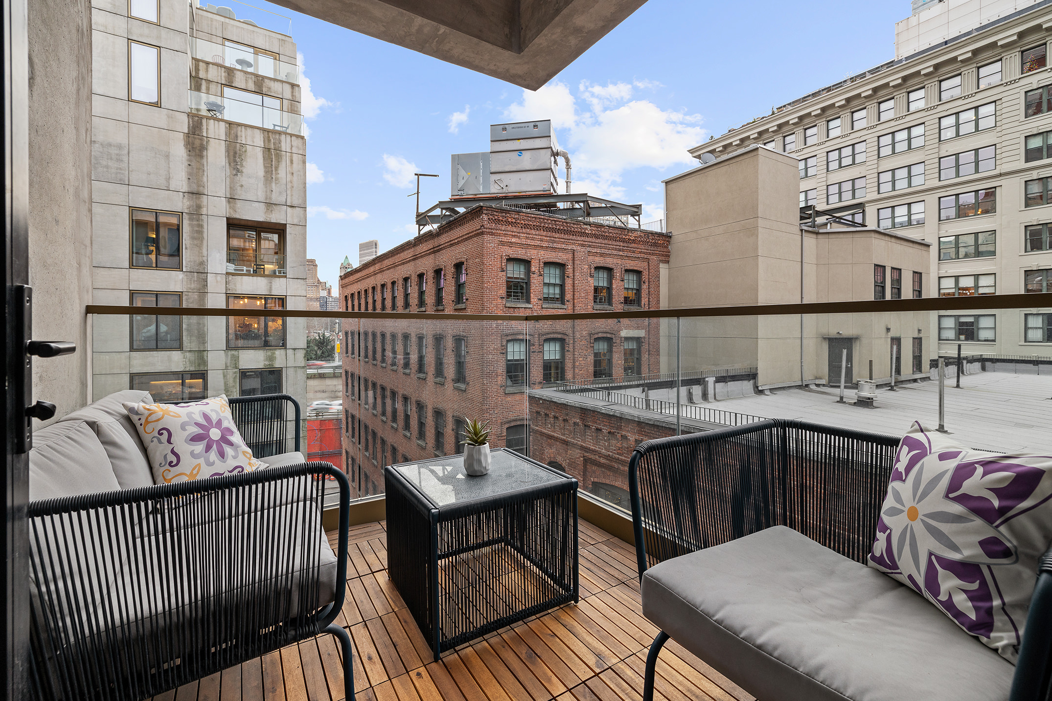 98 Front Street, Unit 8T Brooklyn, NY 11201 - Photo 9 of 18 a view of a balcony with furniture