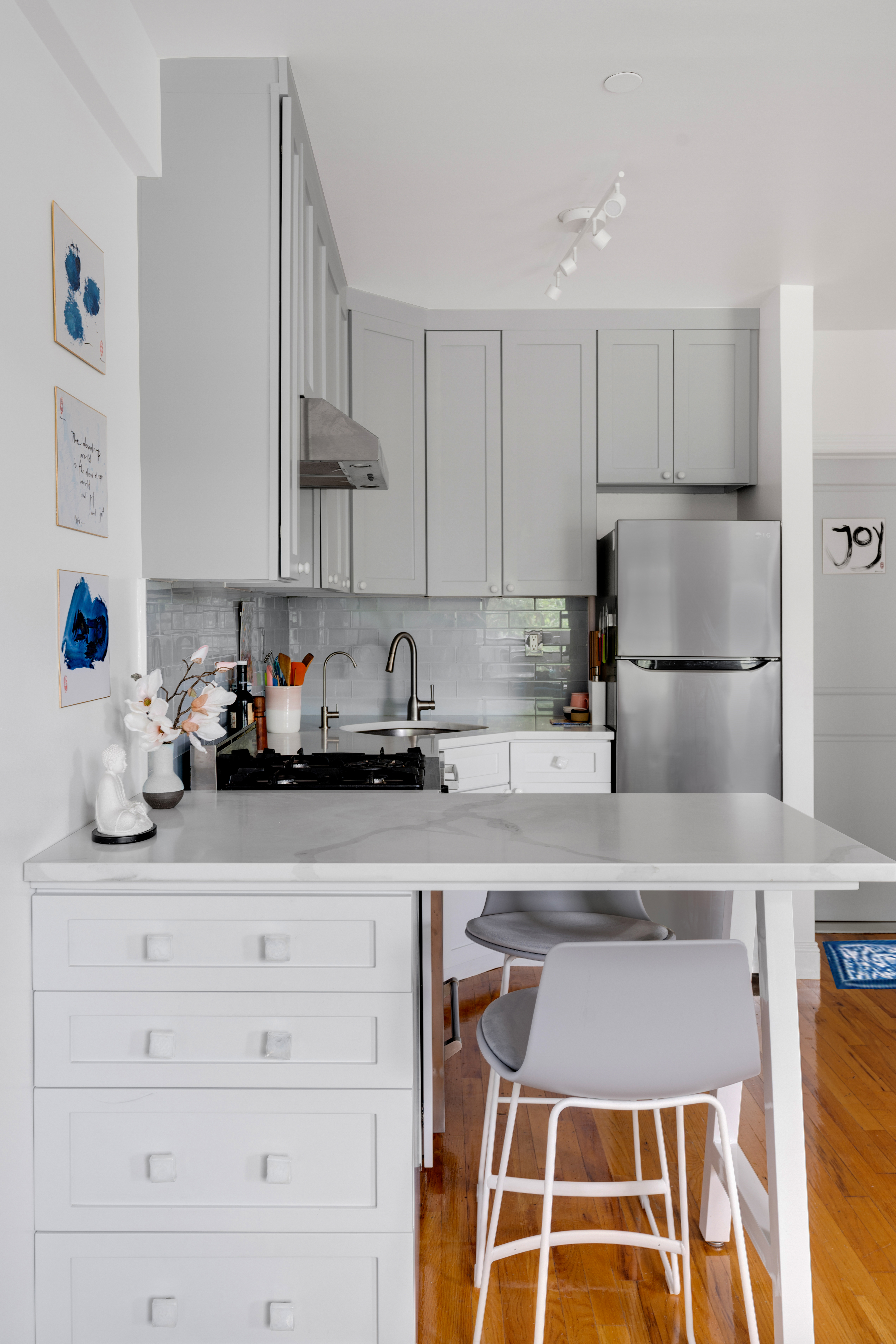 235 West 137th Street, Unit 4F Manhattan, NY 10030 - Photo 3 of 7 a kitchen with a sink and cabinets