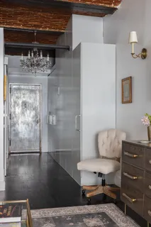 a bathroom with a tub and shower