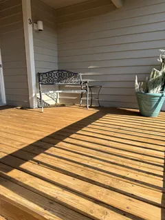 a view of balcony with wooden floor