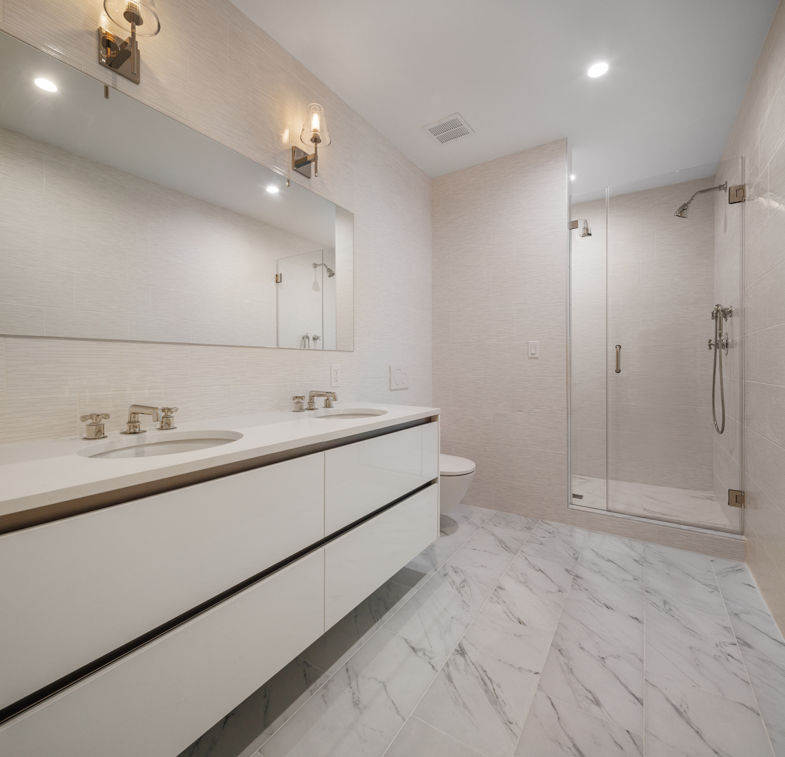 55 Liberty Street, Unit 12C Manhattan, NY 10005 - Photo 8 of 9 a bathroom with a sink and a mirror