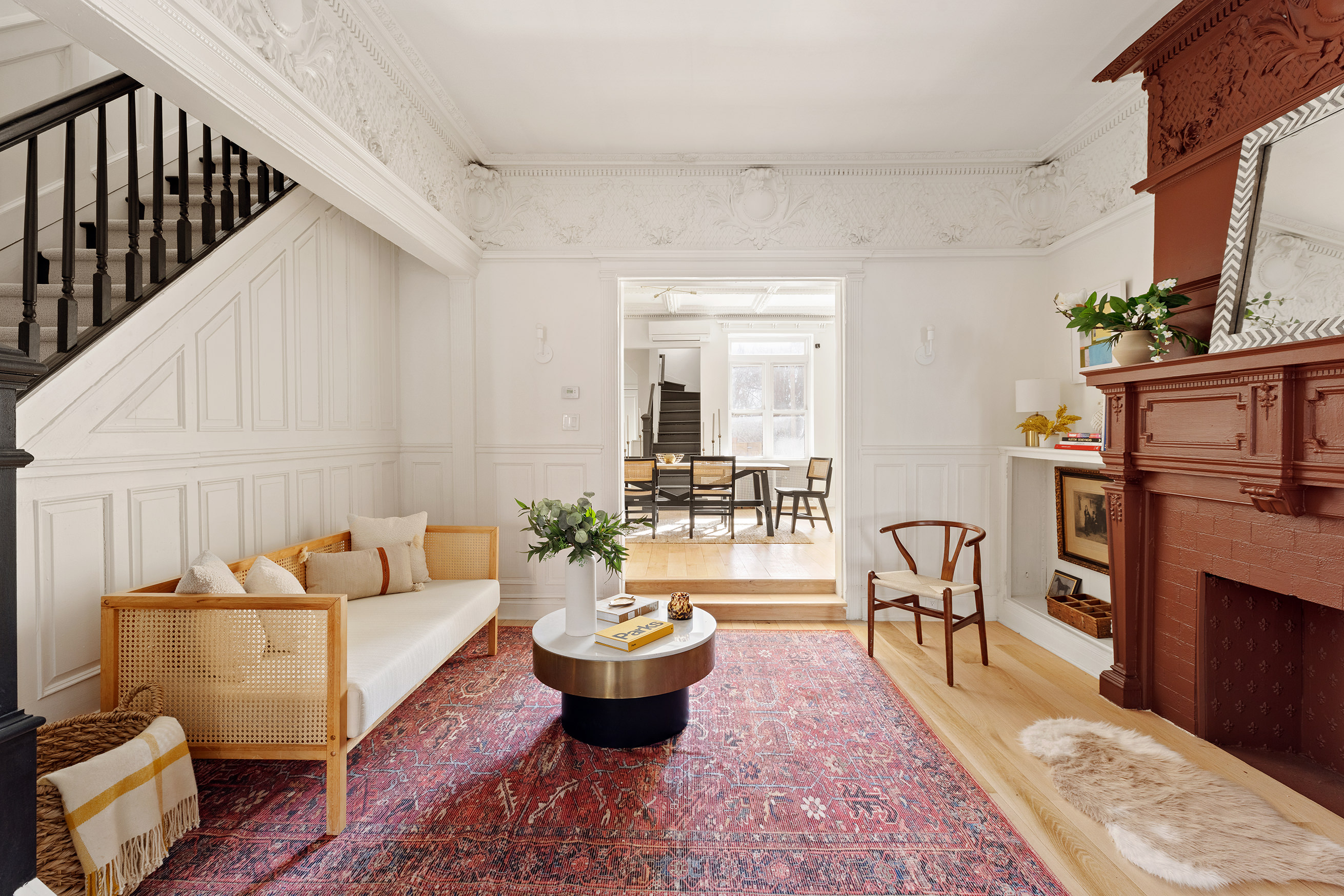 259 New York Avenue Brooklyn, NY 11216 - Photo 7 of 25 a living room with furniture a rug and a dining table with wooden floor