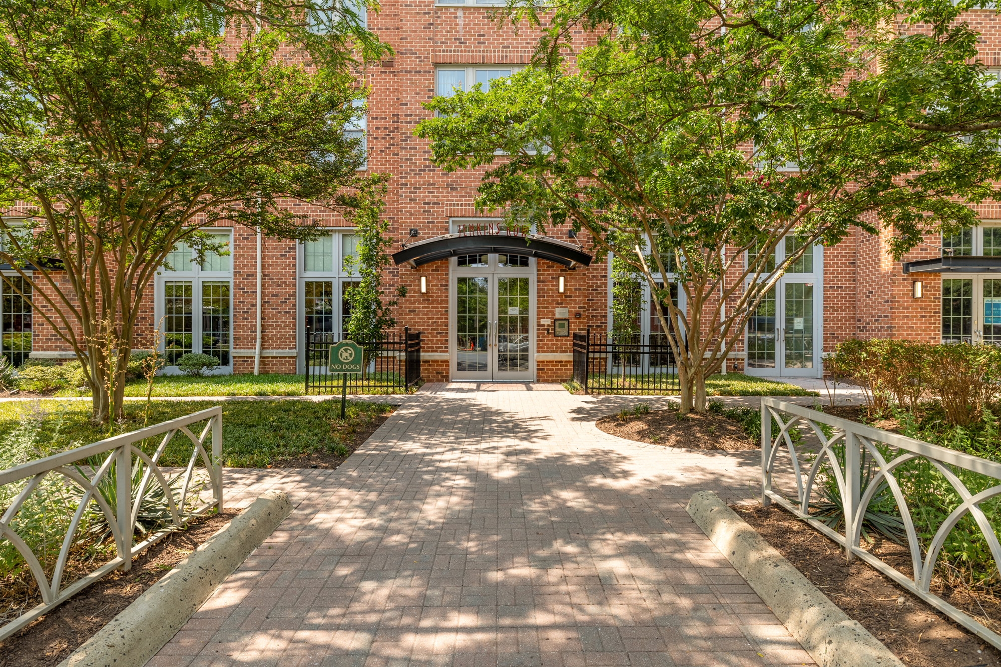 1391 Pennsylvania Ave. Southeast, Unit 324 Washington, DC 20003 - Photo 2 of 33 a front view of a house with a yard