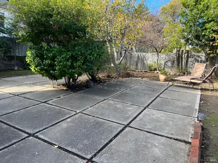 a kitchen with a stove sink and cabinets
