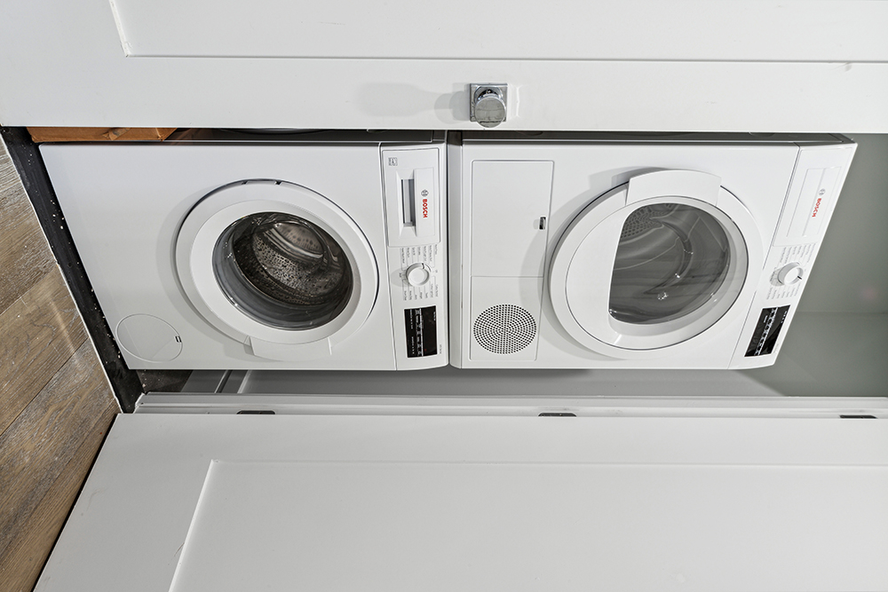 143 Winthrop Street, Unit 3C Brooklyn, NY 11225 - Photo 7 of 9 a utility room with dryer and washer