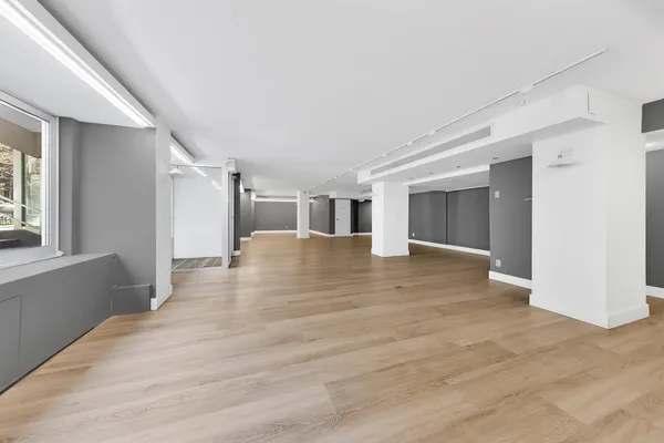 a view of a livingroom with wooden floor
