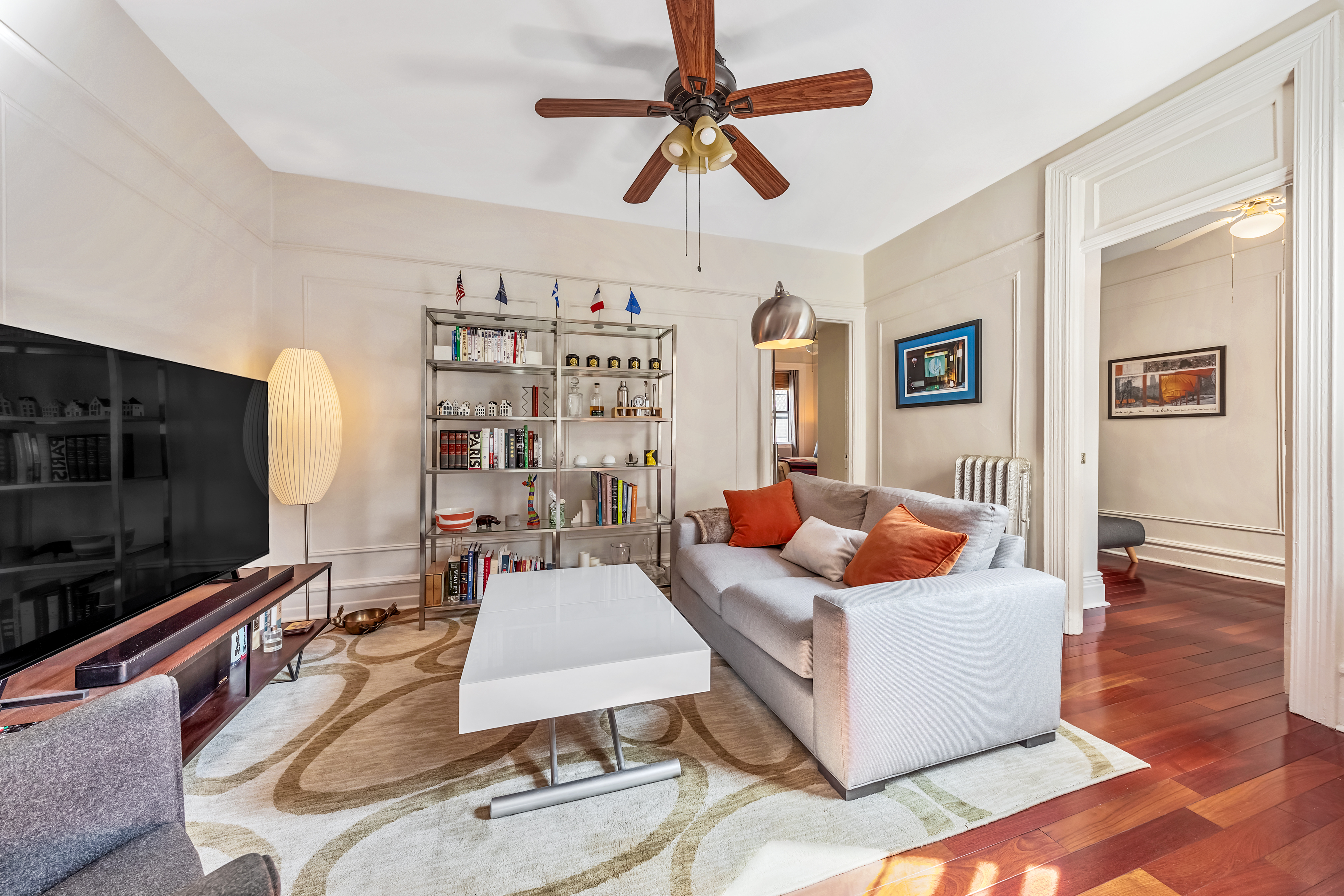 a living room with furniture and a flat screen tv