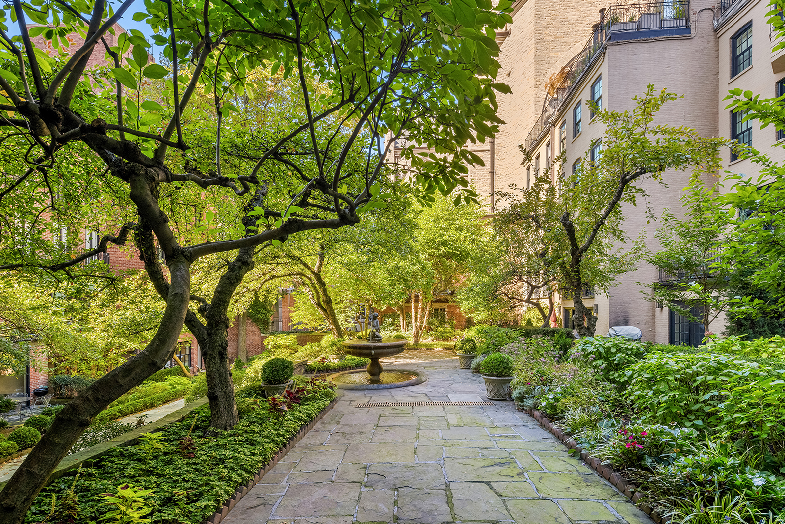 157 East 65th Street Manhattan, NY 10065 - Photo 4 of 28 a view of a pathway with a yard