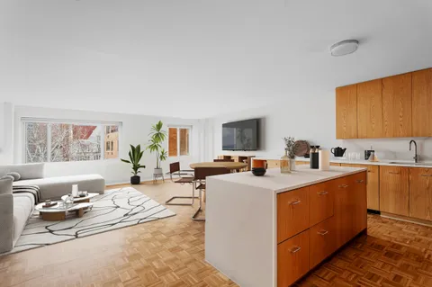 a view of living room with furniture and window