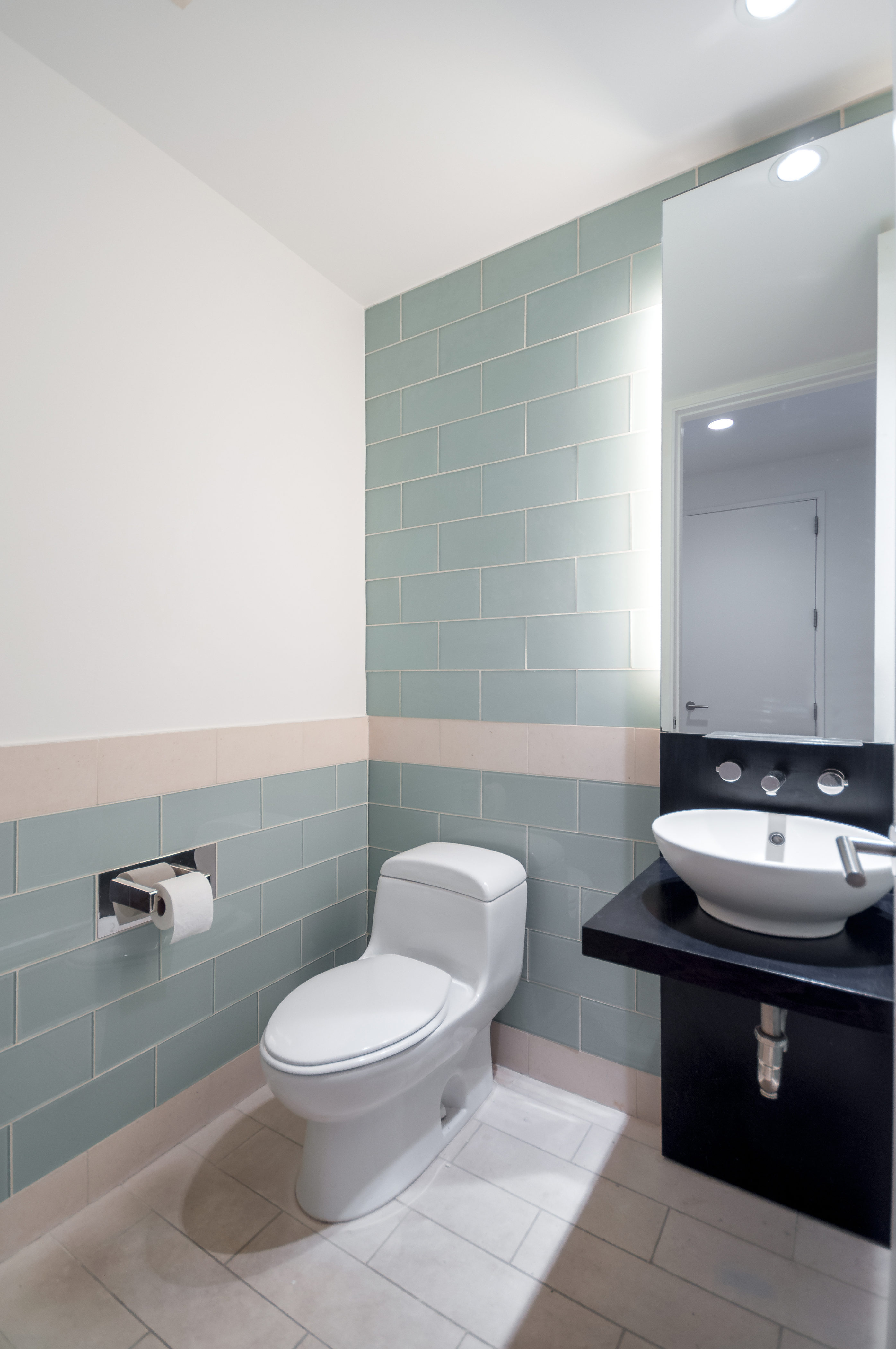 450 East 83rd Street, Unit 3D Manhattan, NY 10028 - Photo 11 of 15 a bathroom with a sink toilet and a mirror