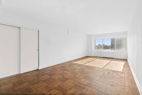 a view of an empty room with a window