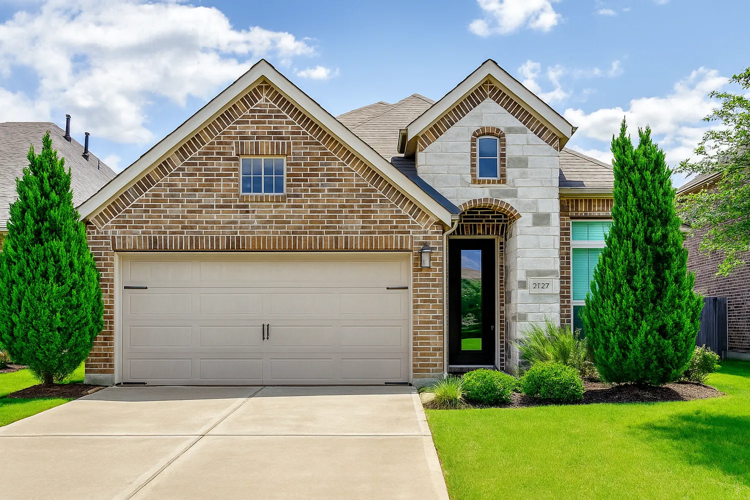 a front view of a house with garden