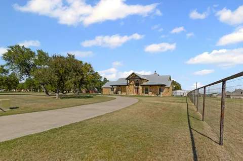 a front view of house with yard outdoor seating and green space