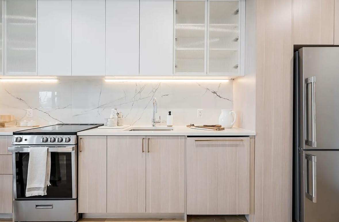 69 Adams Street, Unit 20A Brooklyn, NY 11201 - Photo 3 of 14 a kitchen with stainless steel appliances granite countertop a refrigerator and a sink