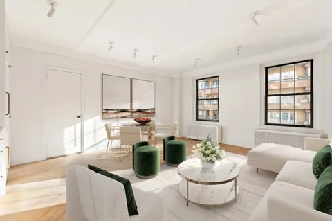 a living room with hard wood floor furniture and a potted plant