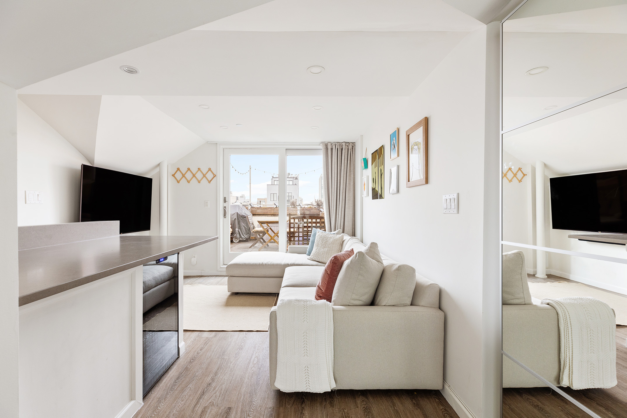 149 Conselyea Street, Unit 4B Brooklyn, NY 11211 - Photo 3 of 10 a living room with furniture and a flat screen tv