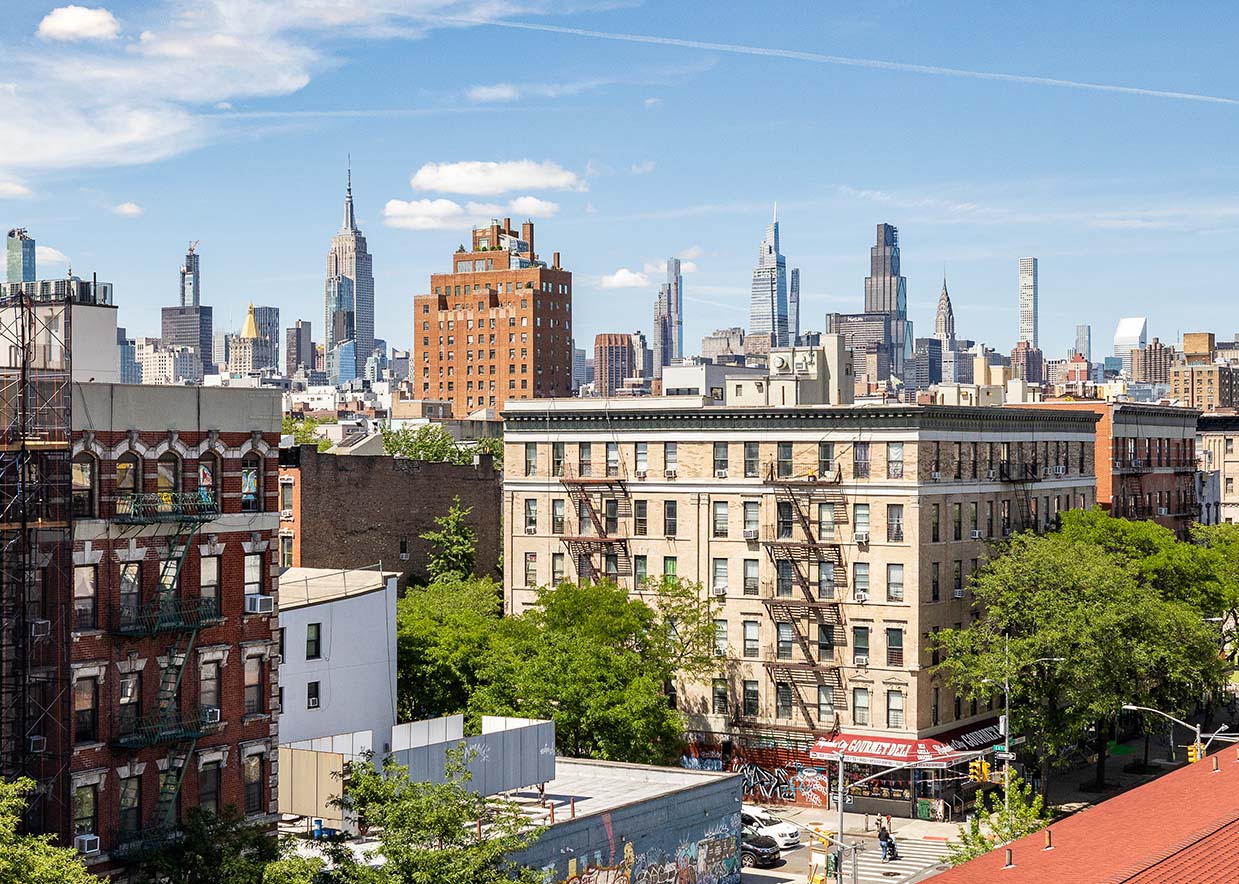 702 East 5th Street, Unit 5E Manhattan, NY 10009 - Photo 12 of 14 a view of a city with tall buildings