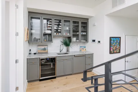 a kitchen with stainless steel appliances granite countertop a stove and cabinets