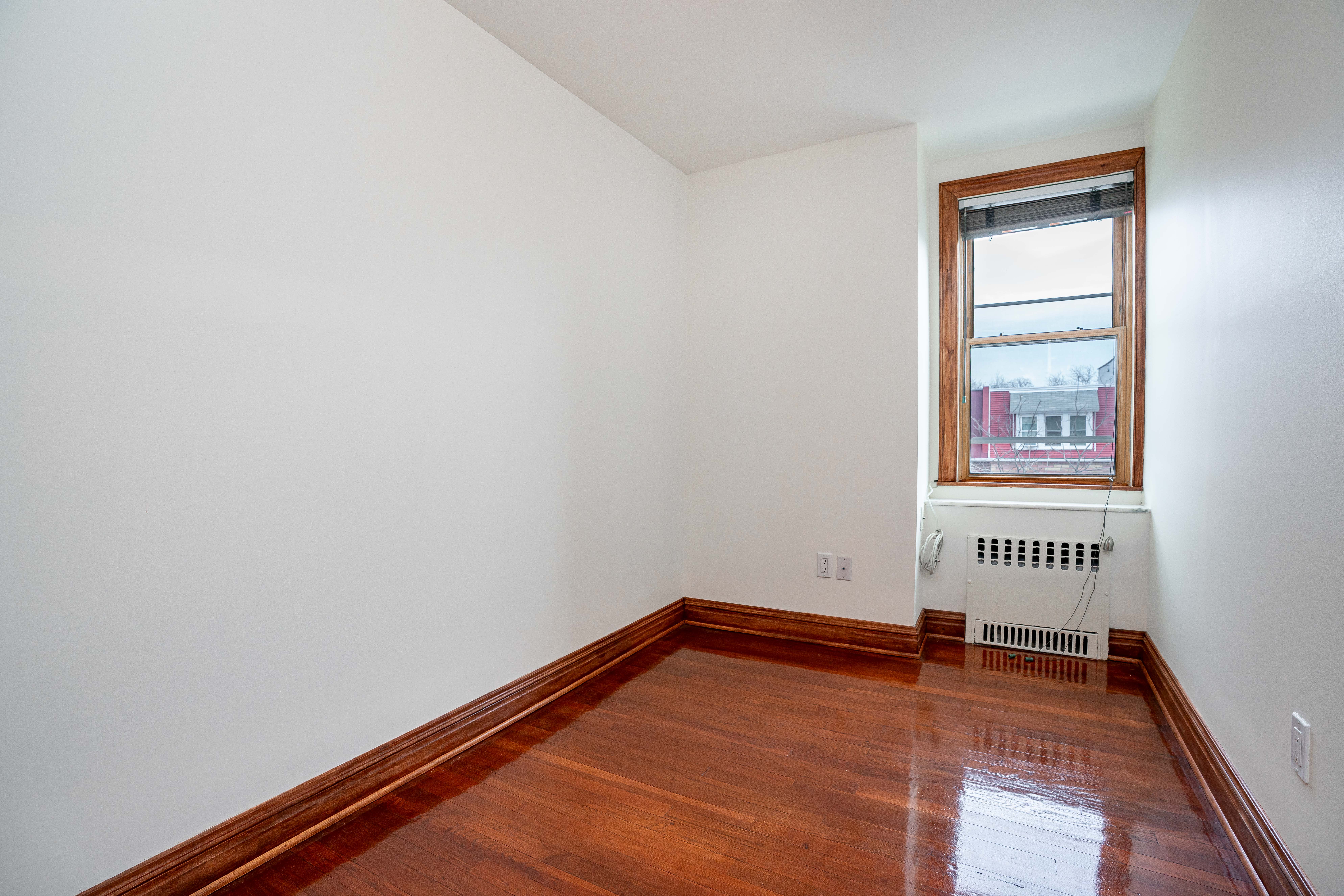 20-60 33rd Street, Unit 2 Queens, NY 11105 - Photo 9 of 10 a view of a room with toys on the wall