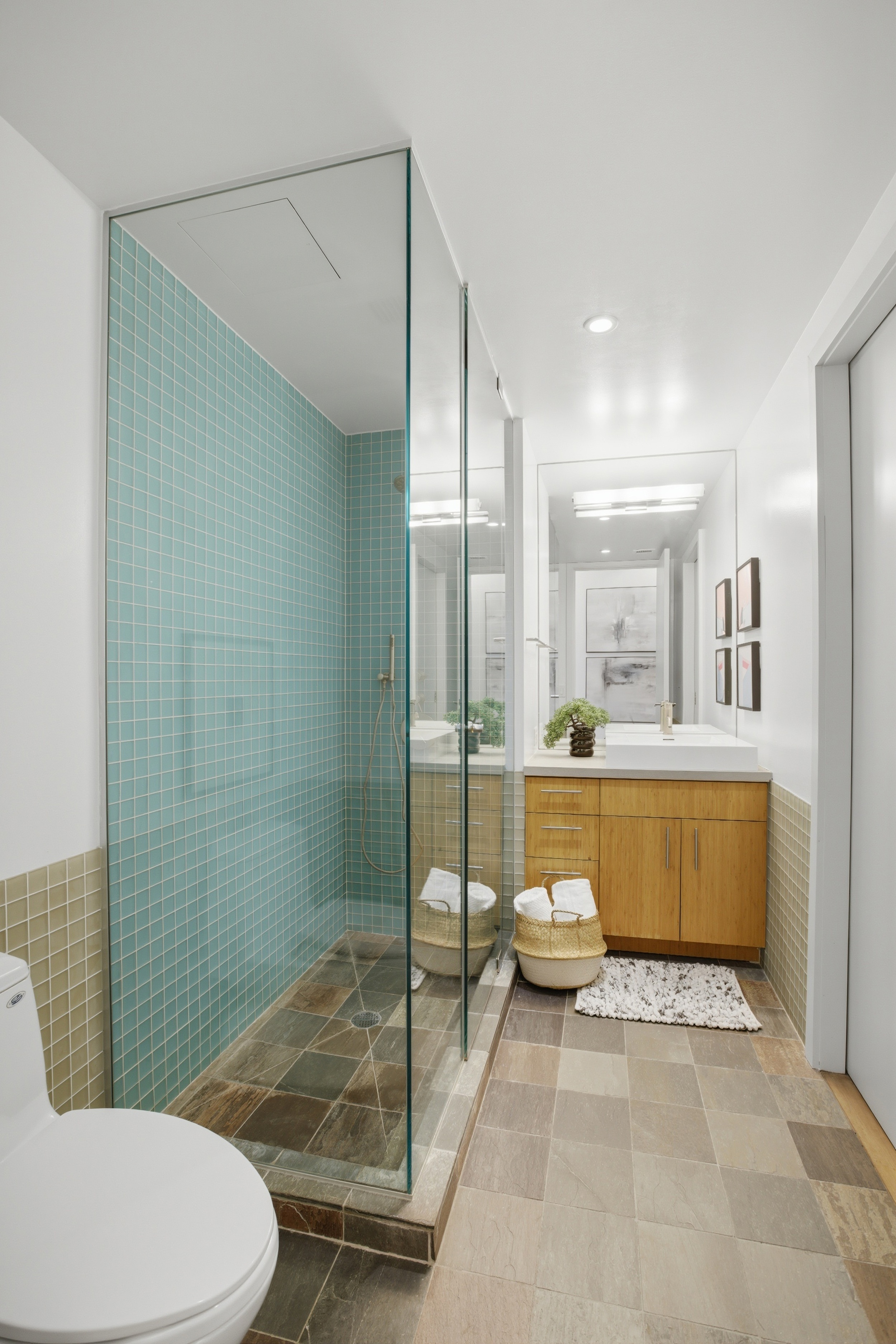 135 West 4th Street, Unit 2W Manhattan, NY 10012 - Photo 17 of 20 a bathroom with a sink a toilet and shower