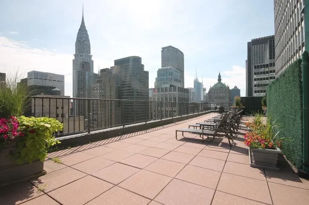 a view of a terrace with wooden benches