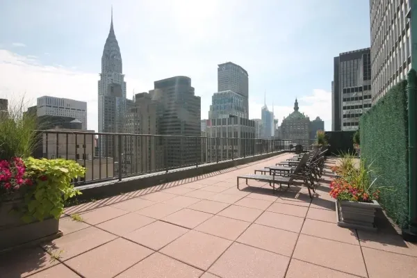 a view of a terrace with wooden benches