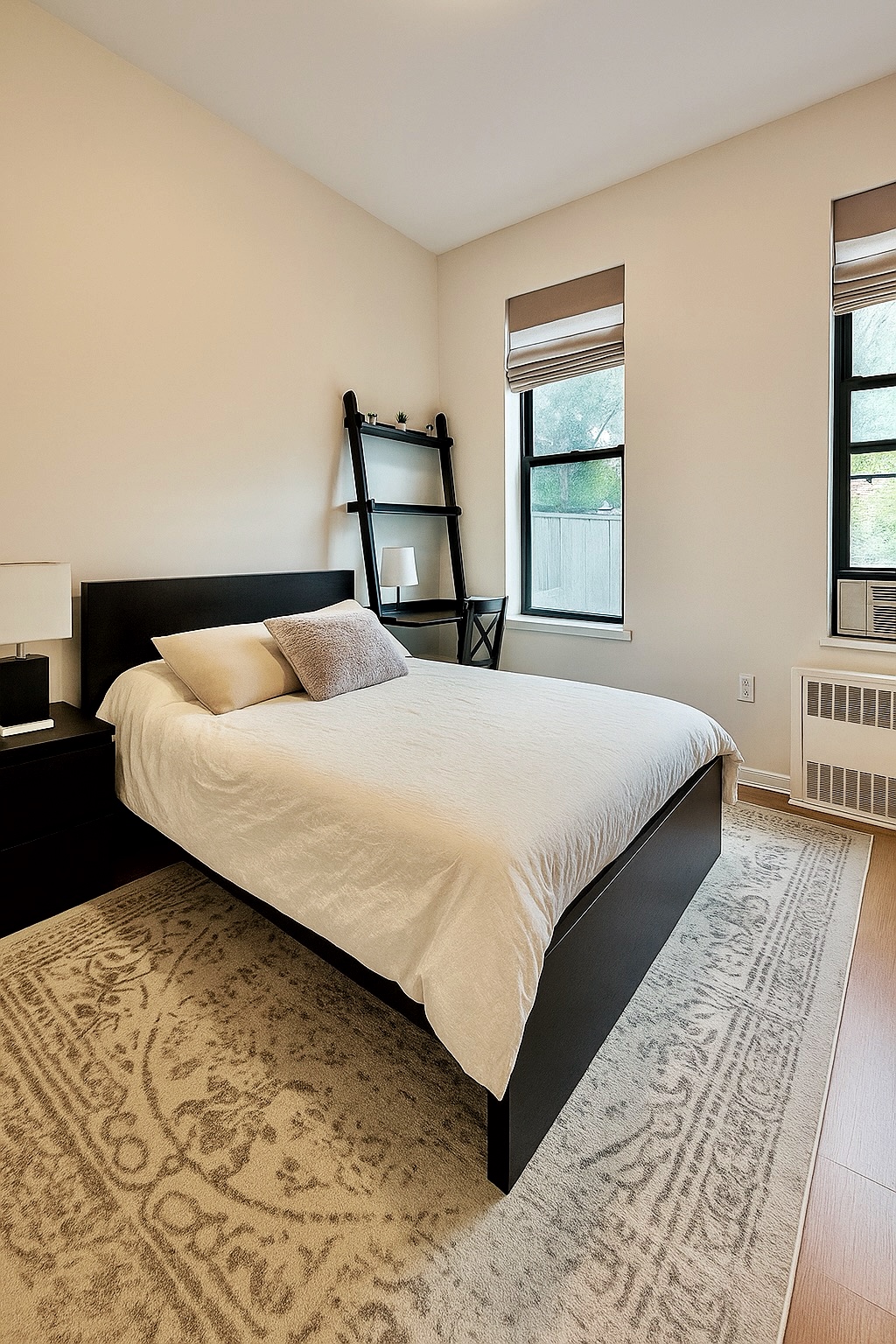 169 Allen Street, Unit 5C Manhattan, NY 10002 - Photo 3 of 11 a bedroom with a bed and window