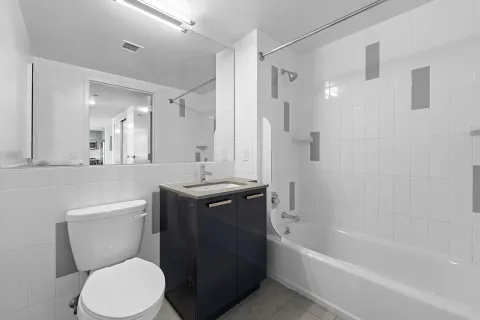 a bathroom with a toilet sink and bathtub