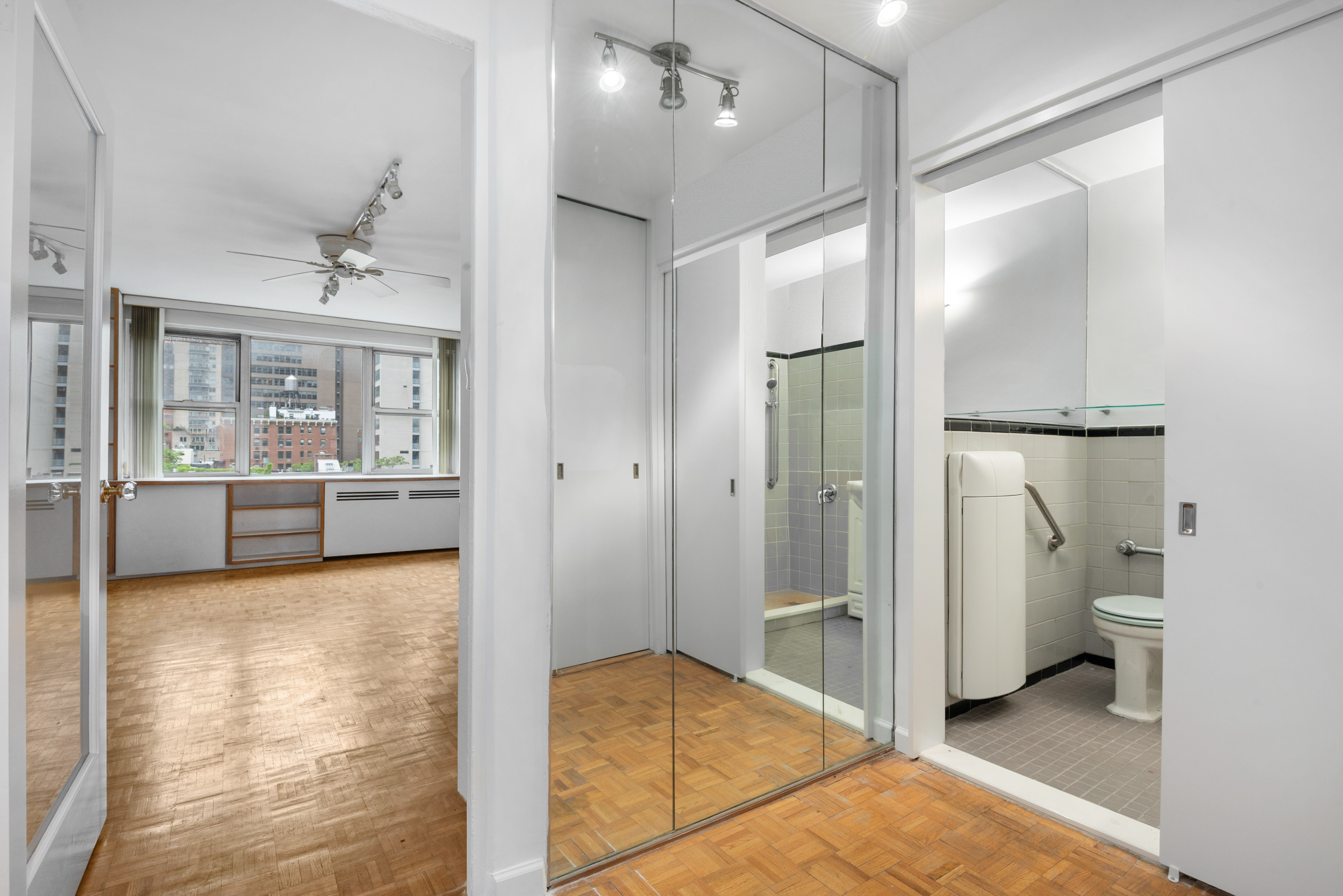 221 East 50th Street, Unit 8B Manhattan, NY 10022 - Photo 6 of 9 a bathroom with a tub and shower