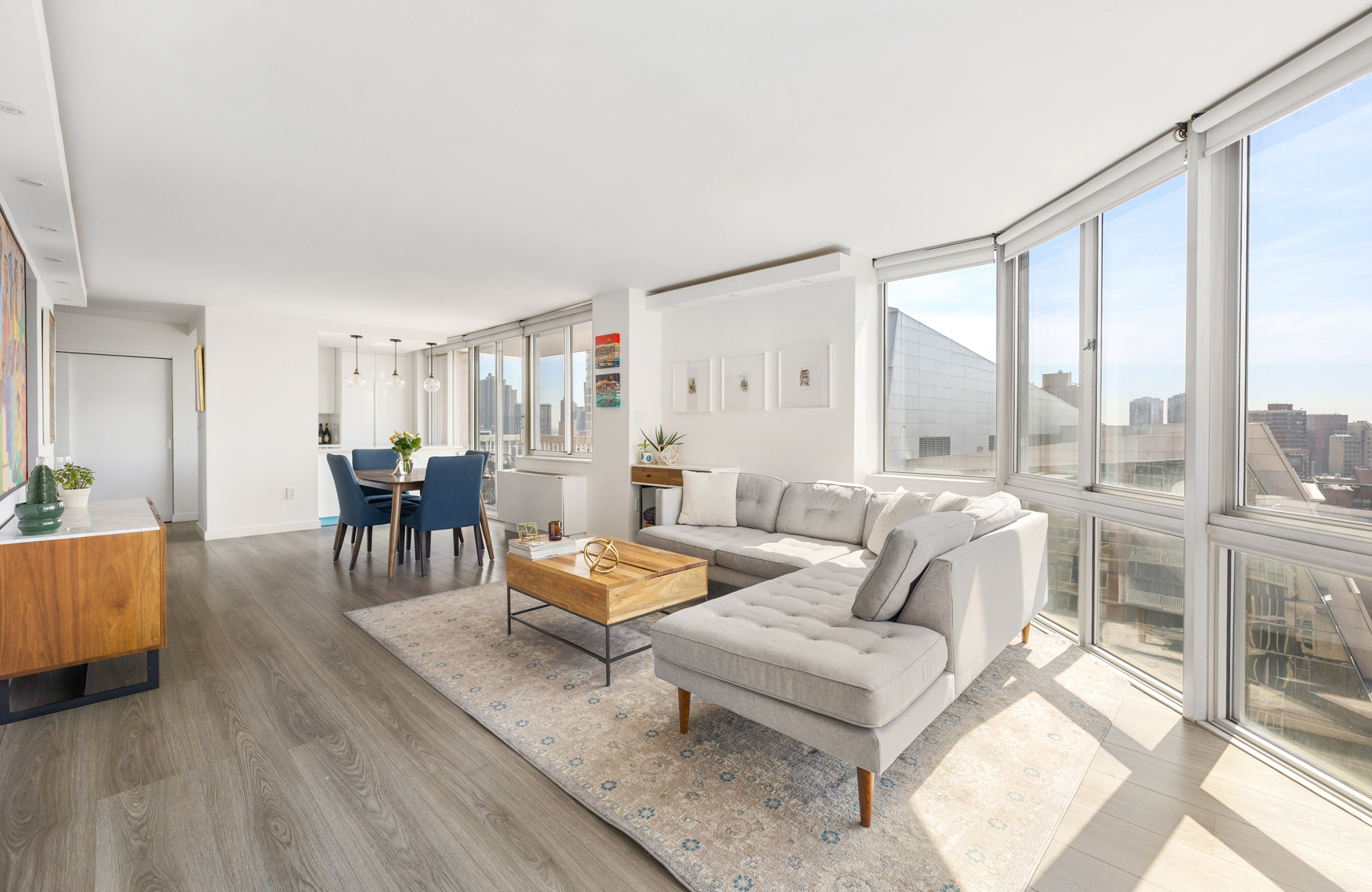 50 Lexington Avenue, Unit 25E Manhattan, NY 10010 - Photo 4 of 13 a living room with furniture and a large window