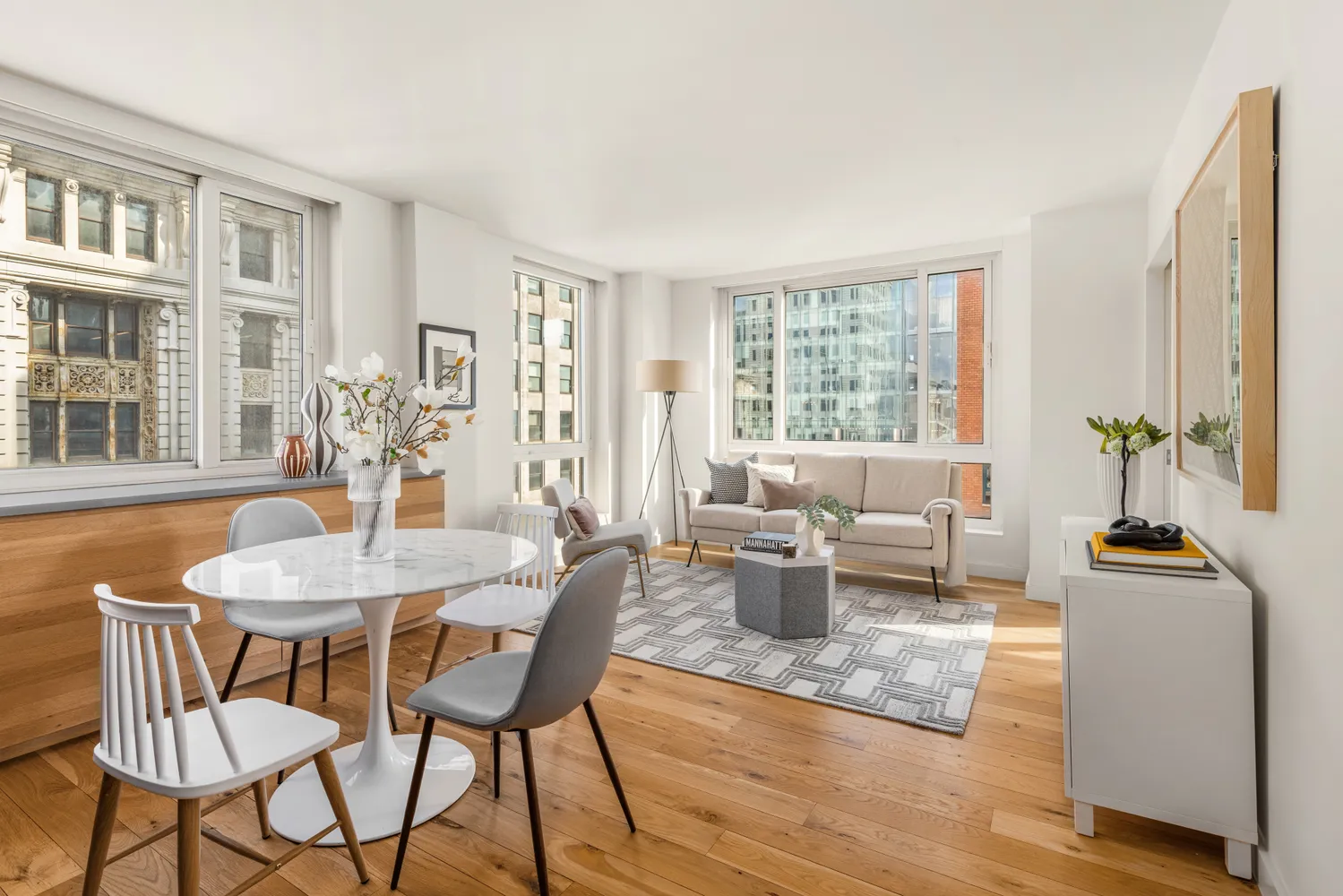 a view of a dining room with furniture window and wooden floor
