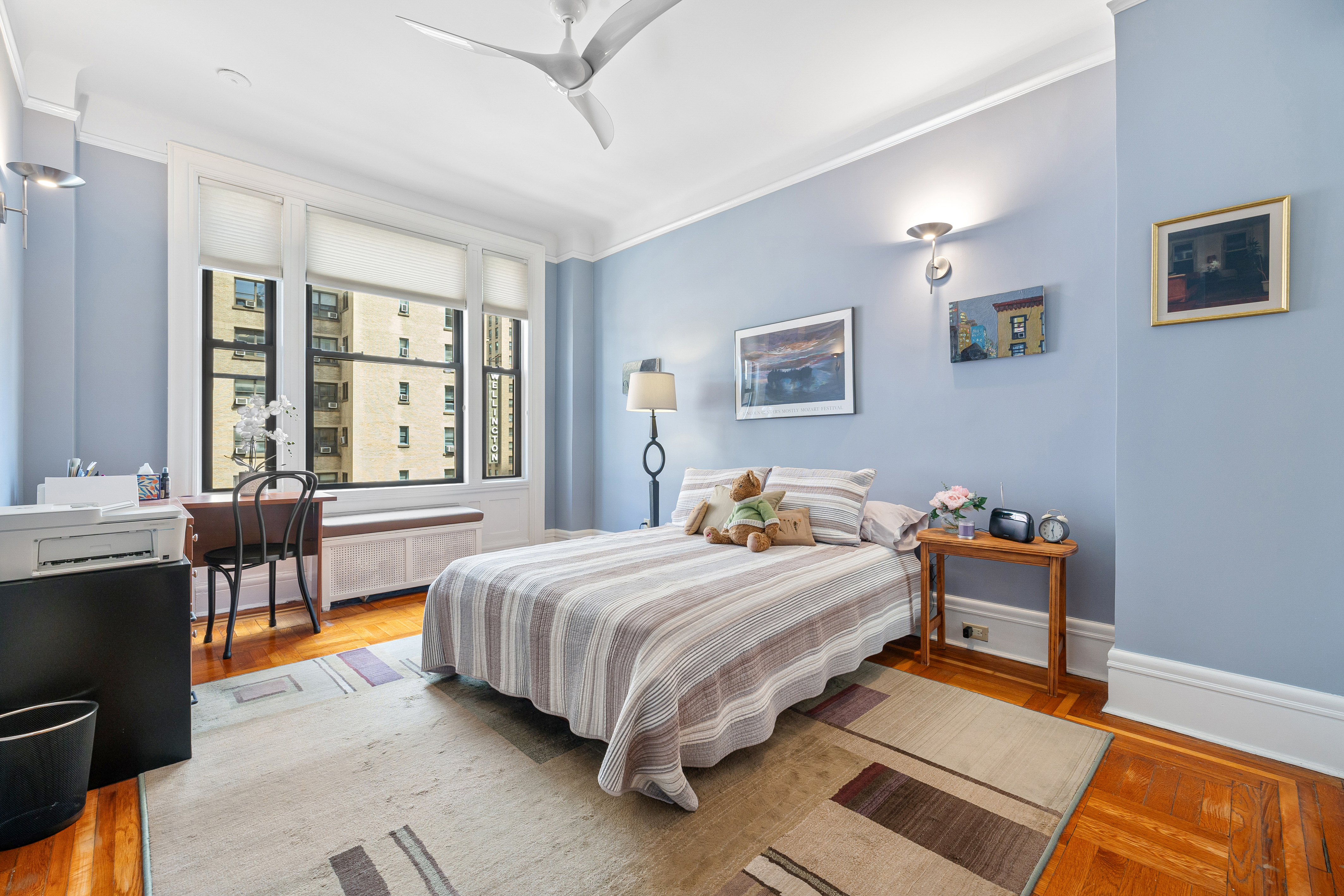 200 West 54th Street, Unit 9G Manhattan, NY 10019 - Photo 10 of 17 a bedroom with a bed and wooden floor