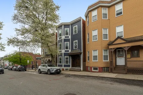 a view of a cars parked in front of a building