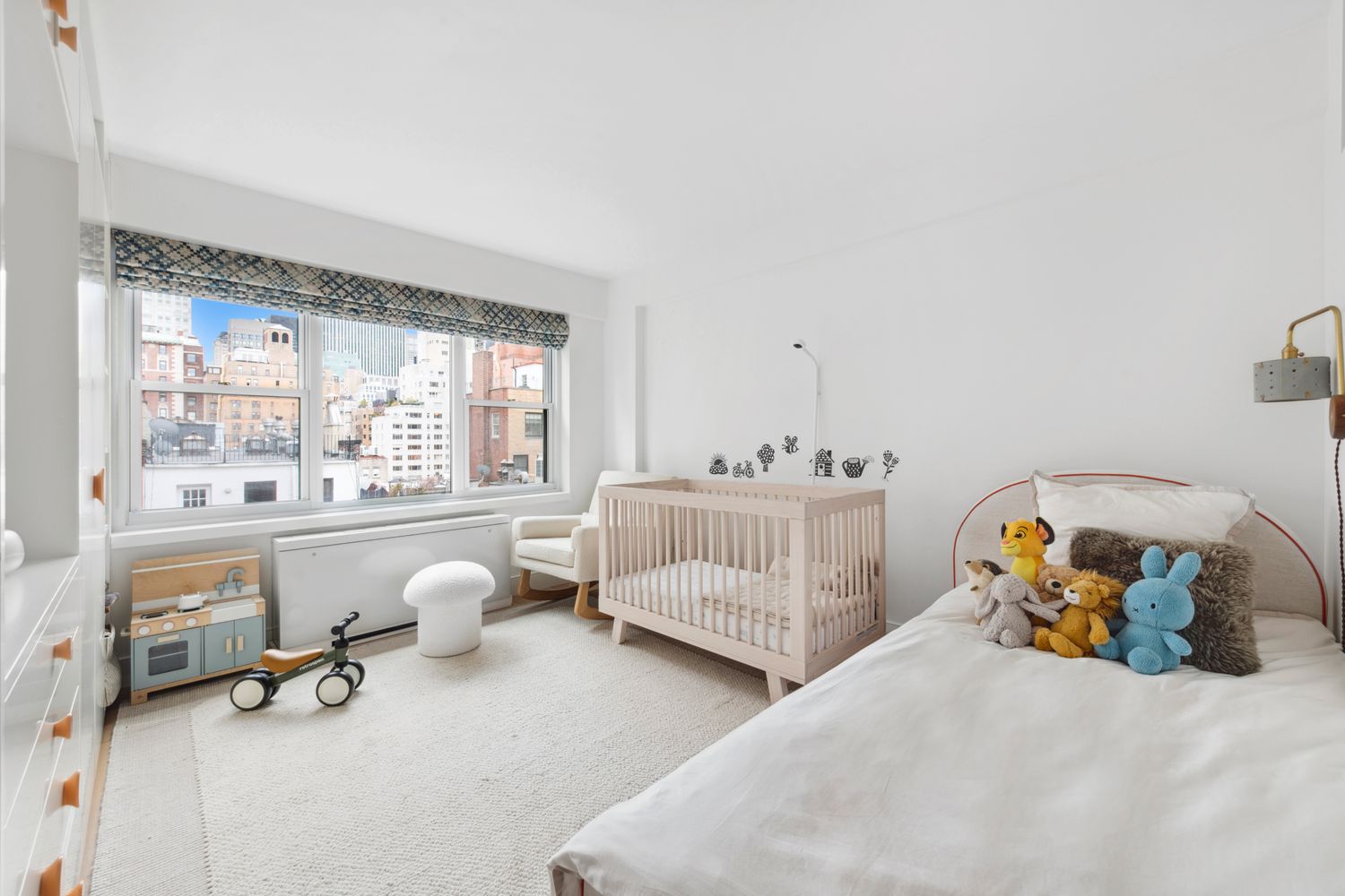 650 Park Avenue, Unit 9B Manhattan, NY 10065 - Photo 9 of 14 a bedroom with furniture and a large window